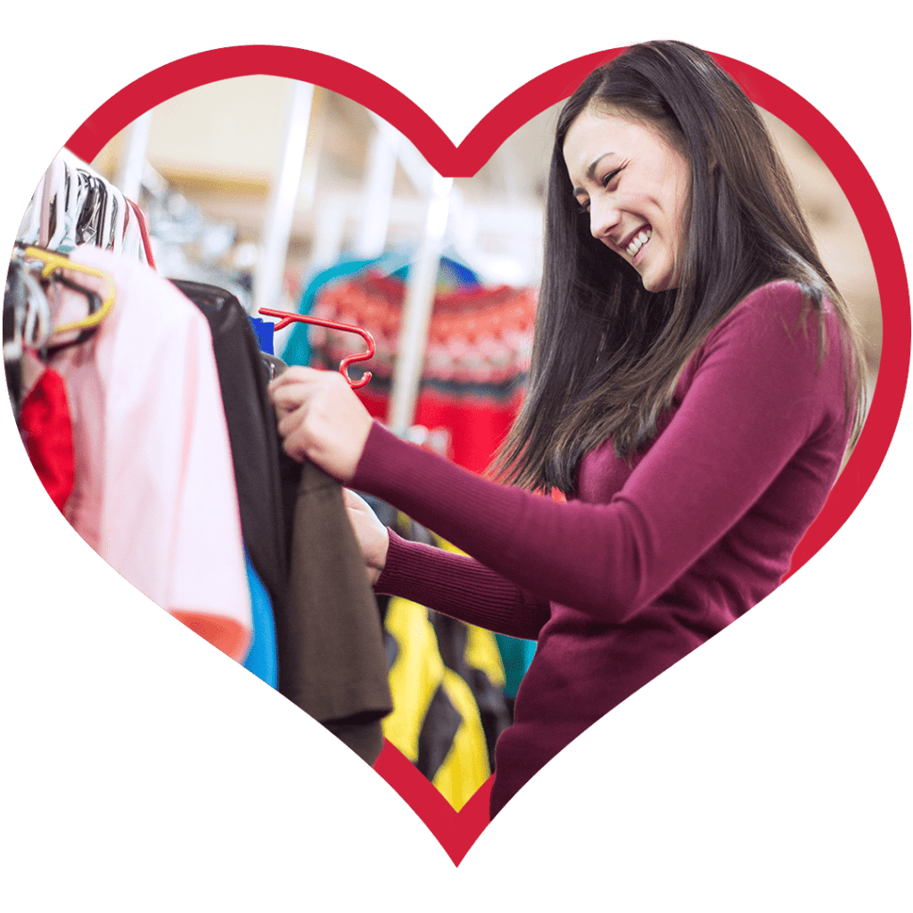 Woman smiling while shopping for clothes